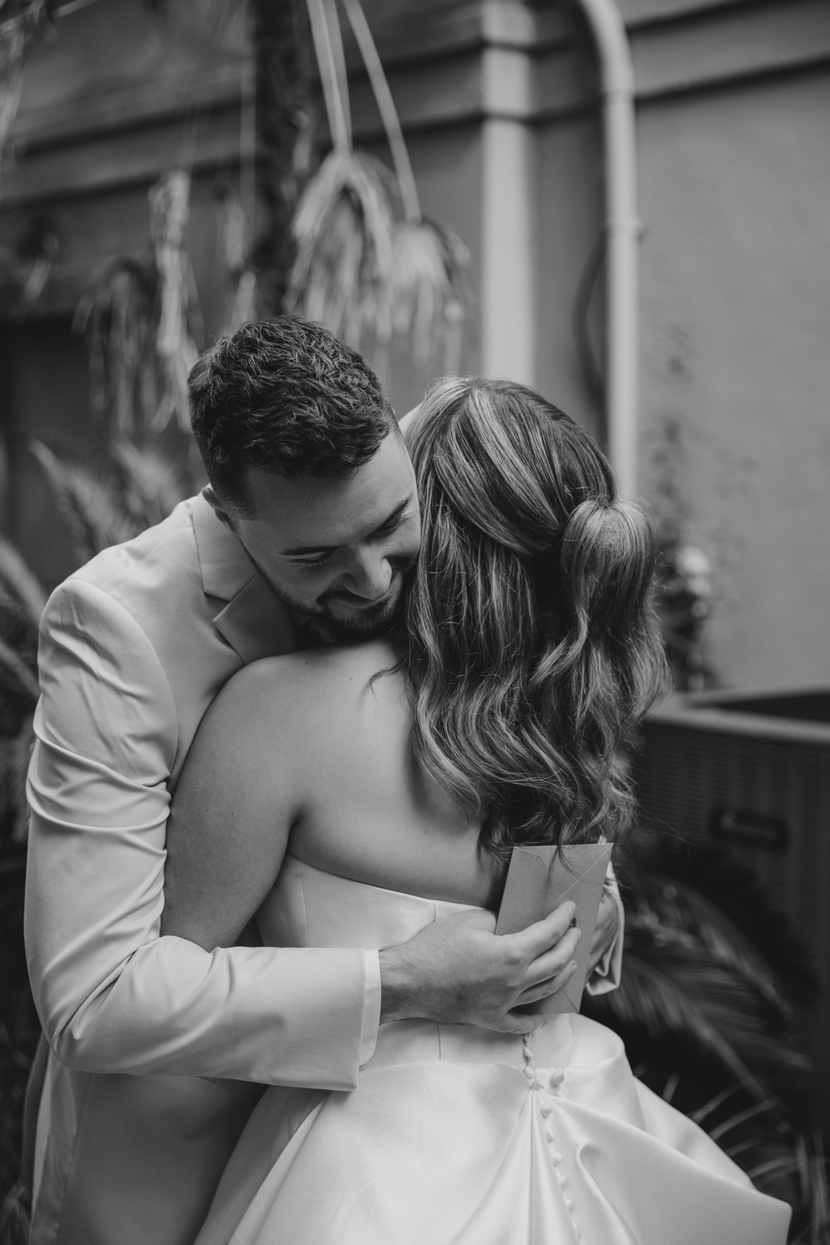 Charleston wedding photographer captures bride and groom embracing on wedding day
