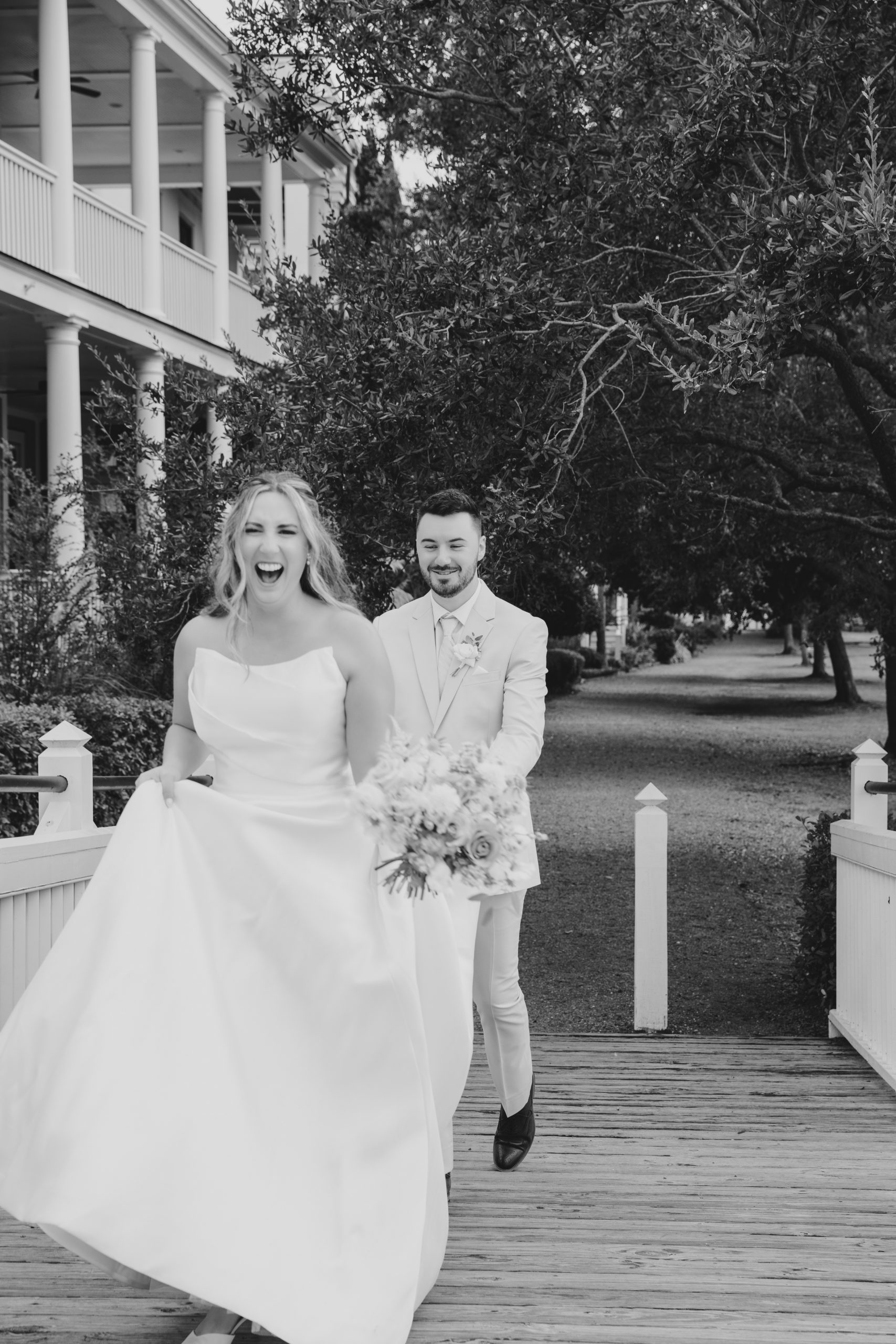 Charleston wedding photographer captures bride and groom running at wedding