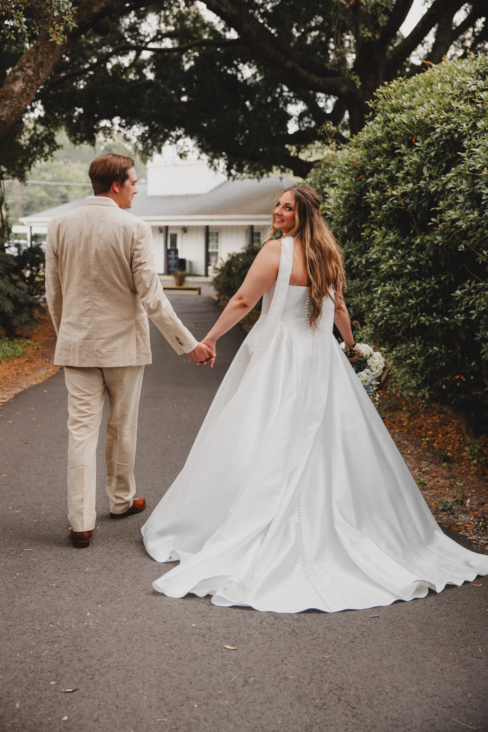 Lowcountry Charleston Bride walks with her fiancé on her wedding day